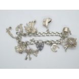 Vintage silver charm bracelet with 10x nice charms London 1978 35.9g