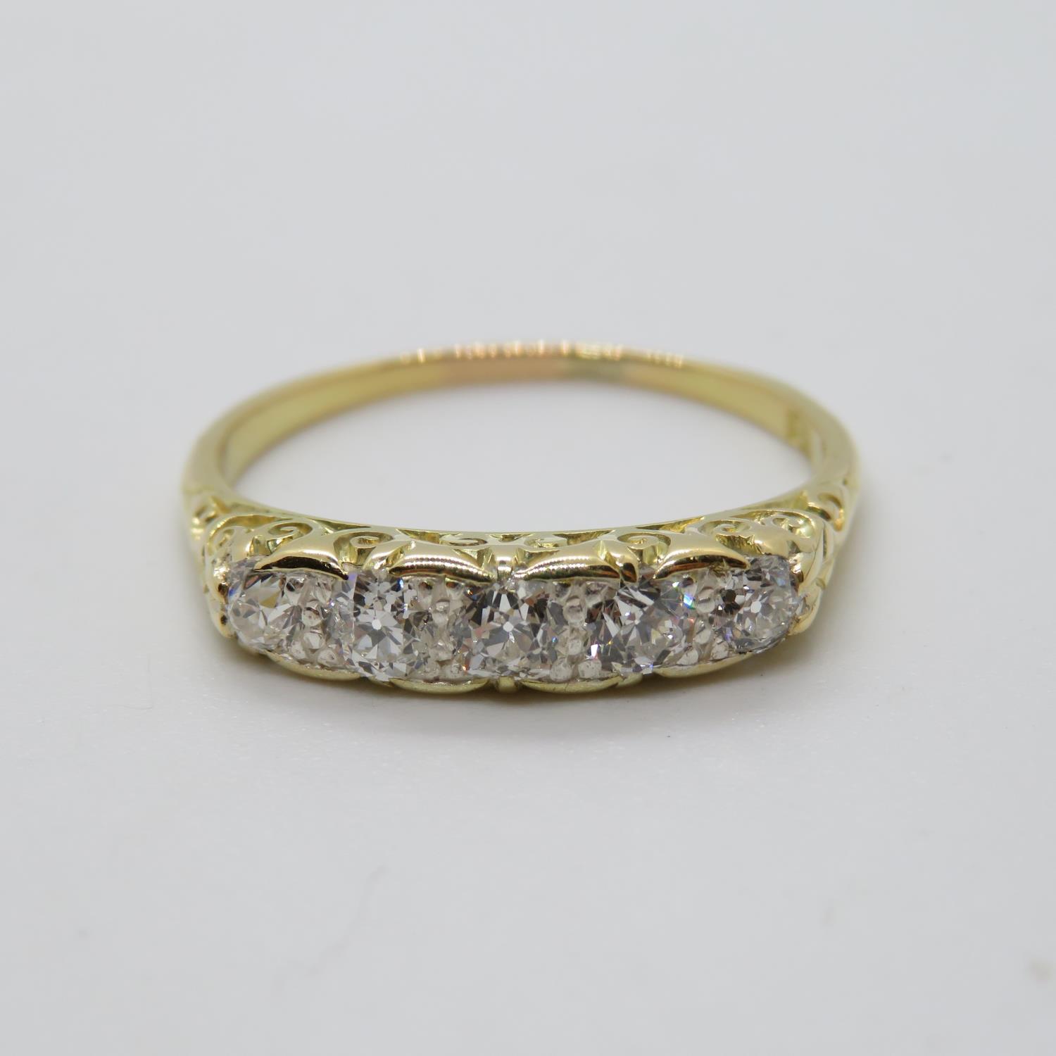 Victorian 18ct gold ring with carved shank set with 5x old cut diamonds approx .5ct size R 2.8g