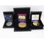 999 pure silver 5oz coin with Battle of Britain 5oz silver coin and 10oz Queen's Coronation coin