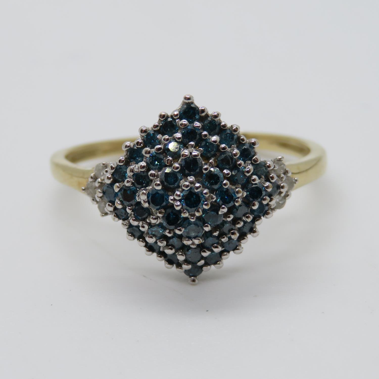 9ct gold ring set with approx .5ct blue and white diamonds size P 2.5g