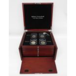 Collector's box in wood with slide out drawers containing 28 brilliant uncirculated US silver