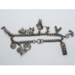 Vintage silver bracelet with 11x nice charms 27.4g
