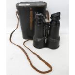 Set of binoculars with case and compass set into binoculars