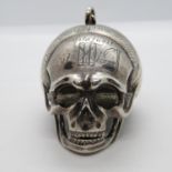 2" very early hinged poison skull with tight fastener - excellent detail - in silver. Engraved on