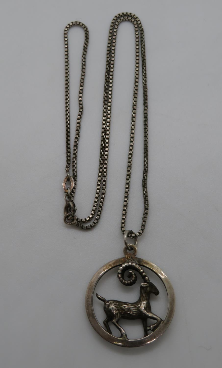 Silver HM Capricorn pendant and chain