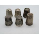 Collection of 5x silver thimbles