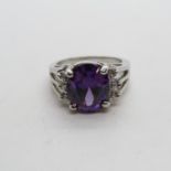 HM 10ct white gold dress ring set with large faceted purple stone size P 6.8g