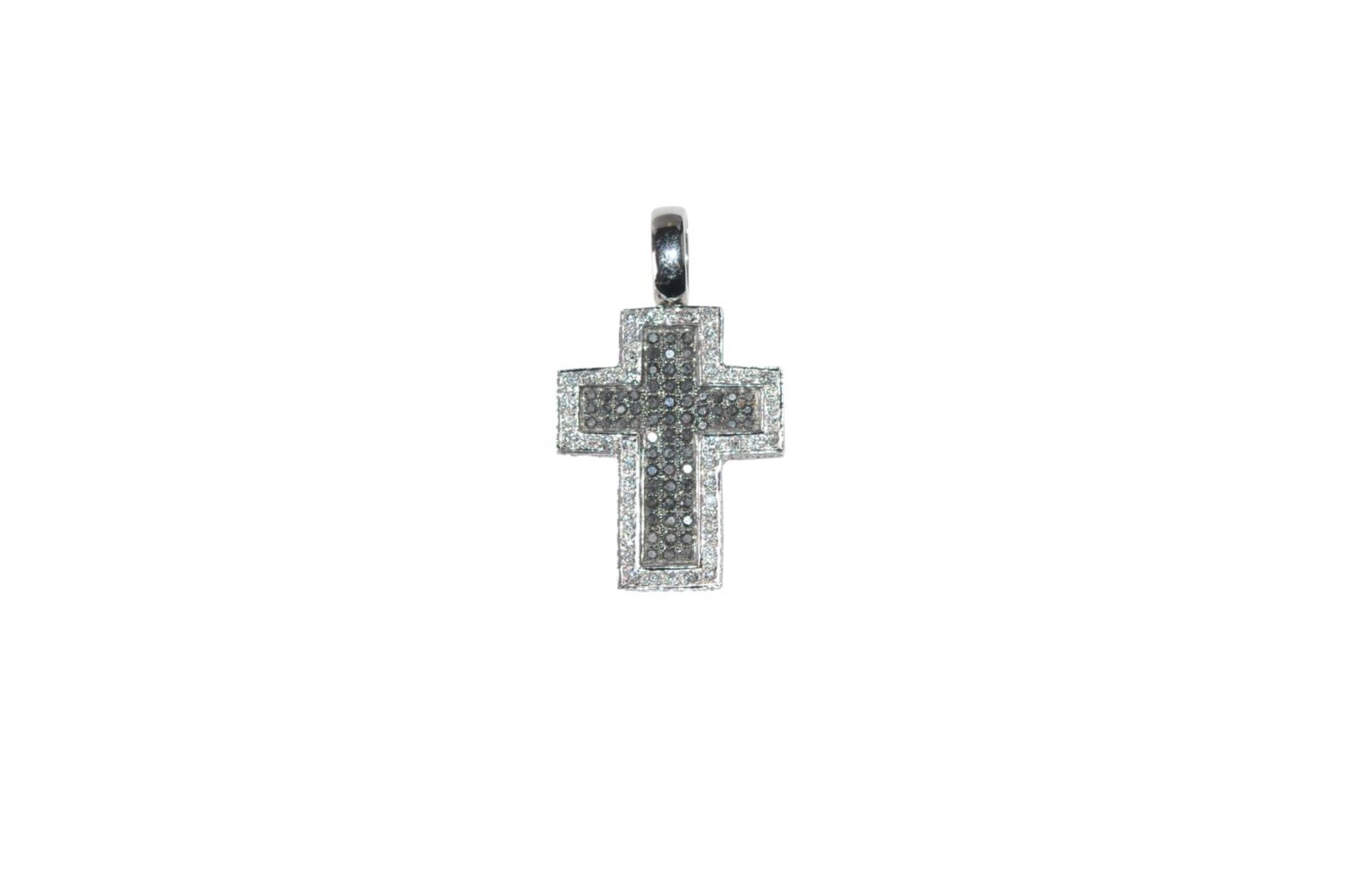 Brilliant cross pendant18Kt white gold cross pendant with white and black diamonds total carat