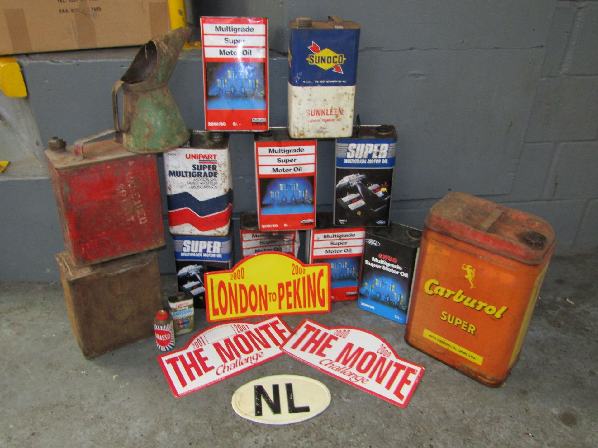 Large quantity of oil cans, fuel cans, Large Carburol Super Can and Rally Plaques