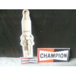 Two Champion Spark Plug Tin Signs