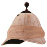 A VICTORIAN OFFICER'S FOREIGN SERVICE HELMET, the six panel doe skin covered cork body with rubbed