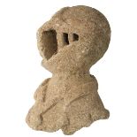 AN INTERESTING STONE FRAGMENT IN THE FORM OF A HELMET, the style and form of this stone element
