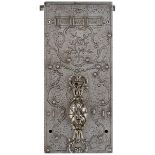 A 17TH OR 18TH CENTURY DOOR LOCK MECHANISM, 18.5cm long, the face plate profusely decorated with