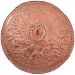 A COPPER ELKINGTON SHIELD, the 55cm diameter body profusely decorated with Classical battle