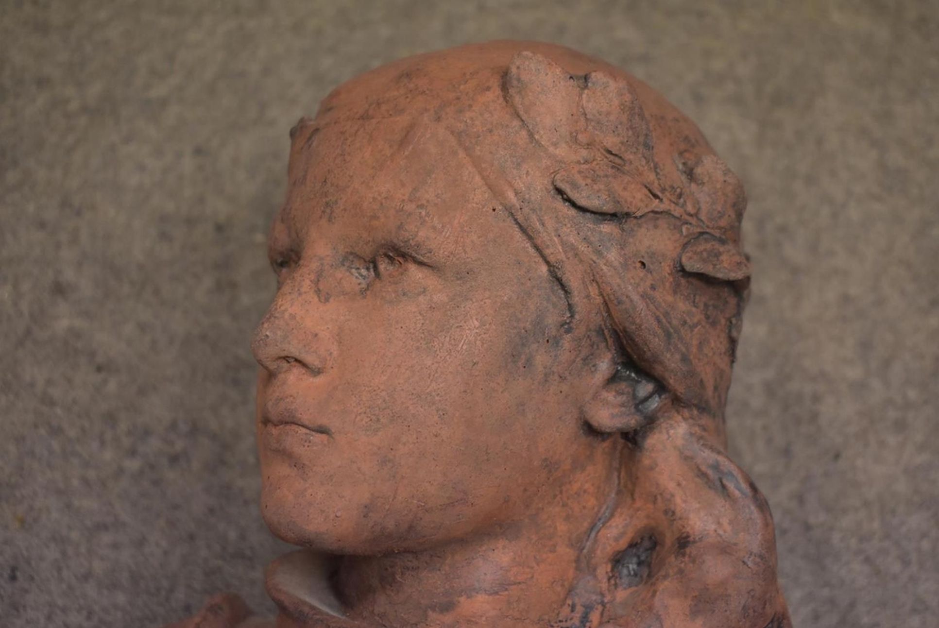 A LATE 19TH/EARLY 20TH CENTURY TERRACOTTA BUST OF JOAN OF ARC, shoulder length and wearing armour, - Image 3 of 9