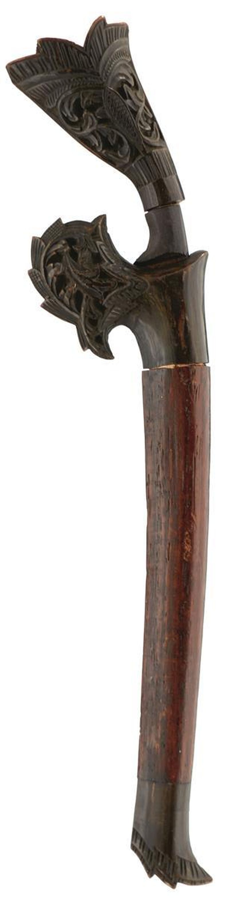 A RENCONG DAGGER, 14.25cm curved blade, characteristic carved wooden hilt, contained in its carved