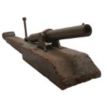 A CHINESE OPIUM WARS OR EARLIER CAST IRON CANNON AND ORIGINAL PIVOT OR SLED MOUNT, 34inch over all