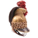 A 19TH CENTURY FRENCH CAVALRY HELMET, the brass skull with horse hair brush, red feather hackle