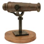 A 19TH CENTURY CAST IRON ONE POUNDER SWIVEL CANNON, 15.25inch heavy four-stage barrel, plain