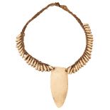 TRIBAL ART: A SHELL AND MARINE IVORY NECKLACE, probably South Seas, with woven cord, together with a