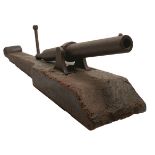 A CHINESE OPIUM WARS OR EARLIER CAST IRON CANNON AND ORIGINAL PIVOT OR SLED MOUNT, 34inch over all