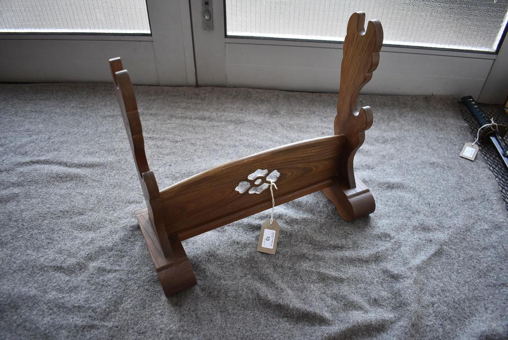 A JAPANESE OAK SWORD STAND, the central panel pierced with a stylized flowerhead. - Image 2 of 4