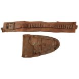 A 19TH CENTURY WESTERN GUN RIG OR HOLSTER ENSEMBLE, the leather belt accommodating forty cartridges,