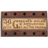 A GREENER FIRING POINT AMMUNITION STAND, for .22 calibre containing two various .22 cleaning