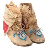 A PAIR OF 19TH CENTURY NATIVE AMERICAN INDIAN MOCCASINS, possibly Western Plains Arapaho, soft
