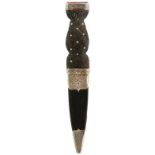 A VICTORIAN SGEAN DUBH, 9.5cm fullered blade with faceted back edge and clipped back tip,