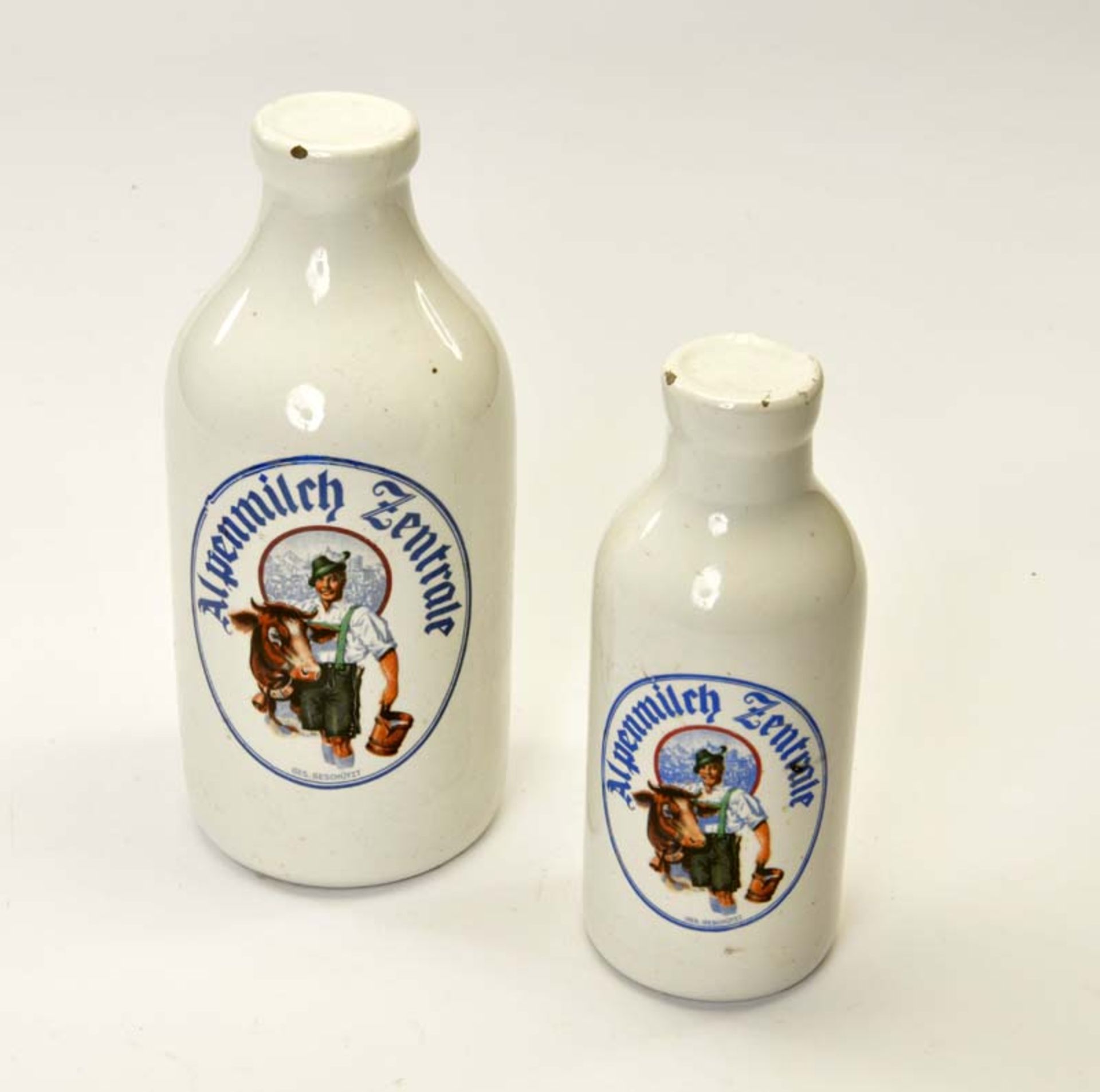 Milkbottles out of Porcelain "Alpenmilch Zentrale", Austria (Wilhelmsburg), 1x upper border damaged,