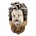 Putto.Barocker Puttenkopf. Geschnitzes Holz, farbig gefasst, tls. mit Goldfarbe. 18. Jh. Ca. 27