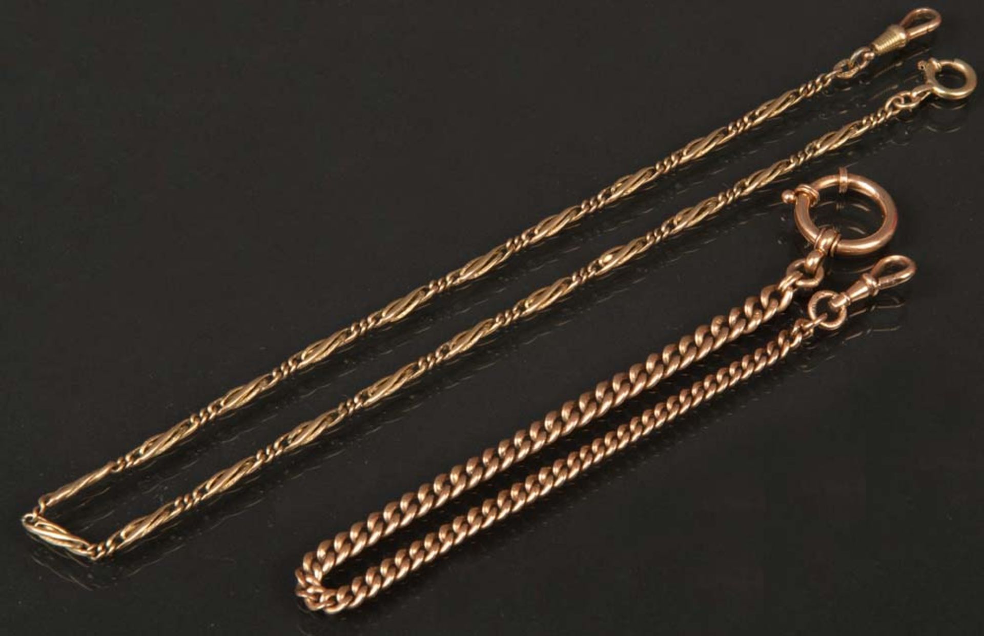 Hals- und Uhrenkette. 8 ct Gelbgold, ca. 9 g, bzw. 14 ct Rotgold, ca. 18 g, L=39 /26 cm.