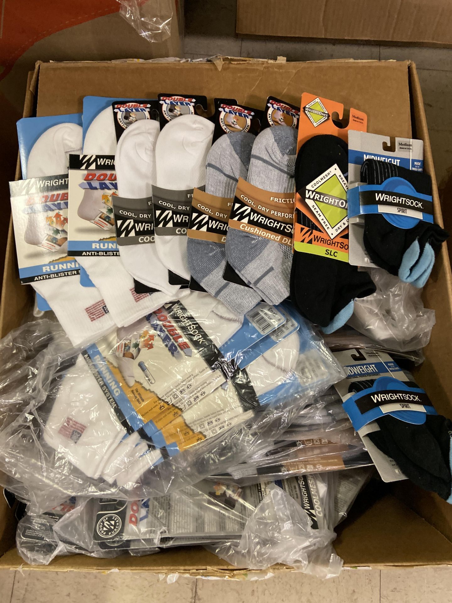 250+ packs of New Socks, Wrightsocks Various Styles, Various Colors Lot includes approximately 250