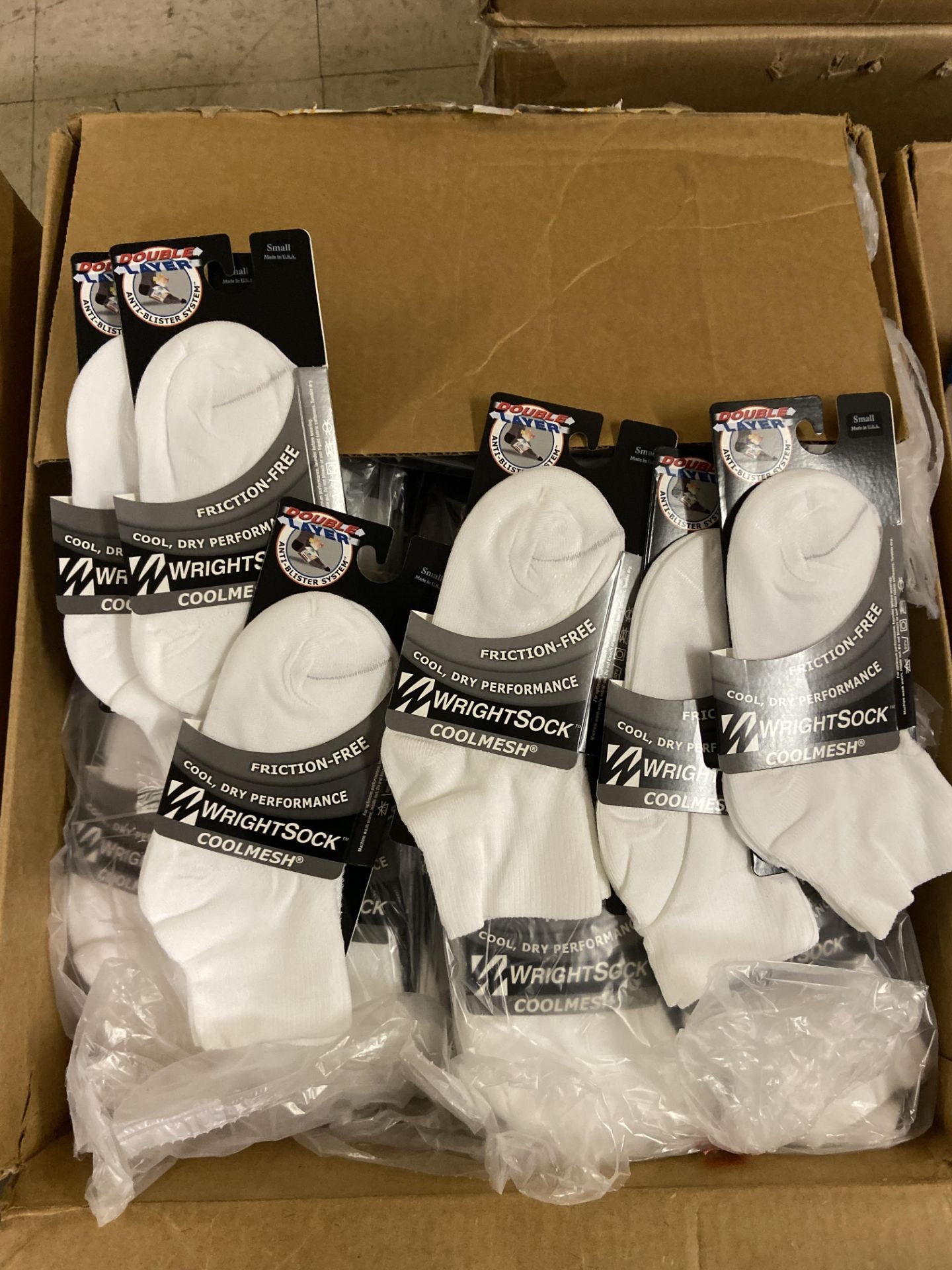 250+ packs of New Socks, Wrightsock Coolmesh, Double Layer, White Each lot has approx 250 packs,