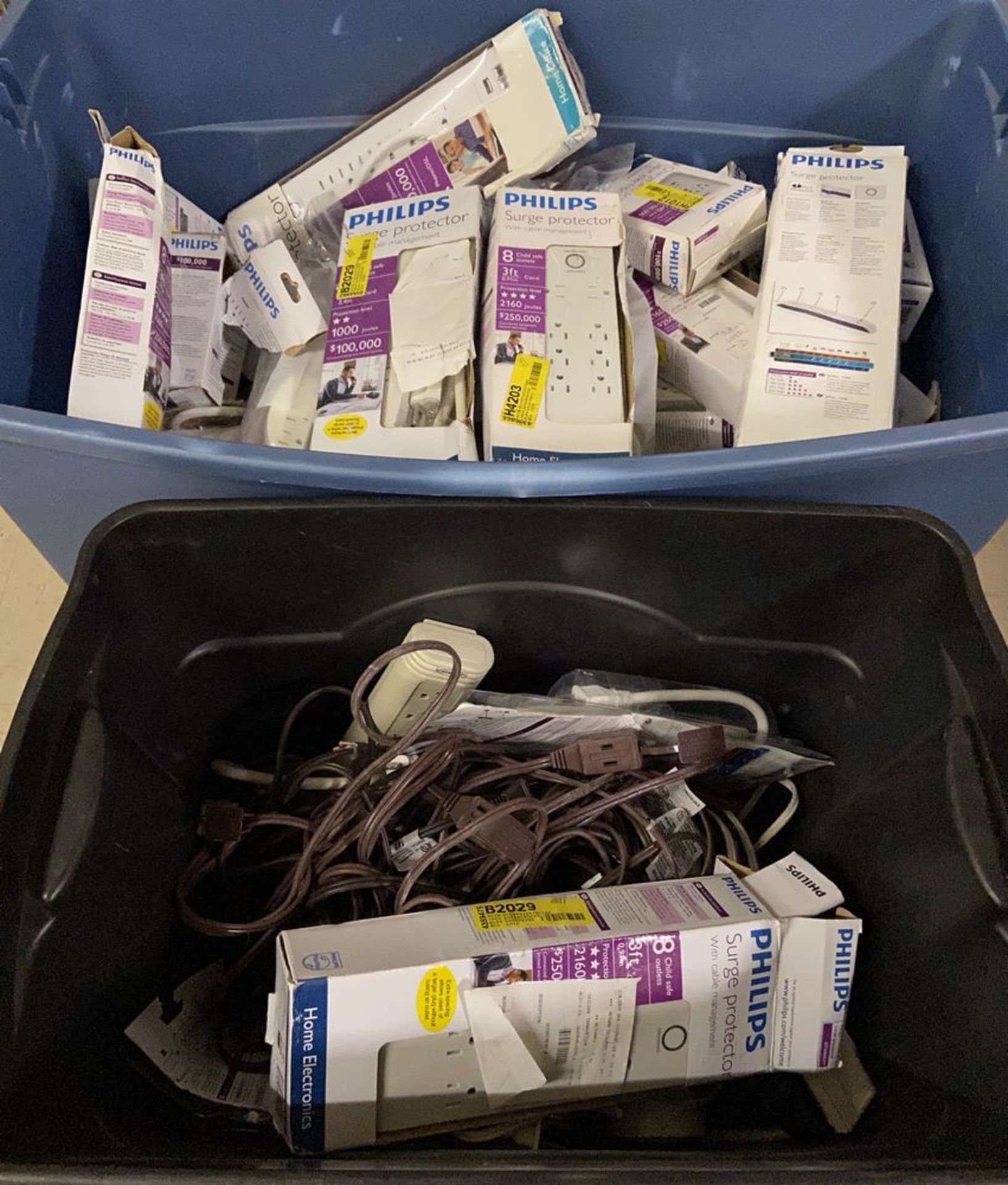 Large Bin of Philips Surge Protectors and Extension Cords