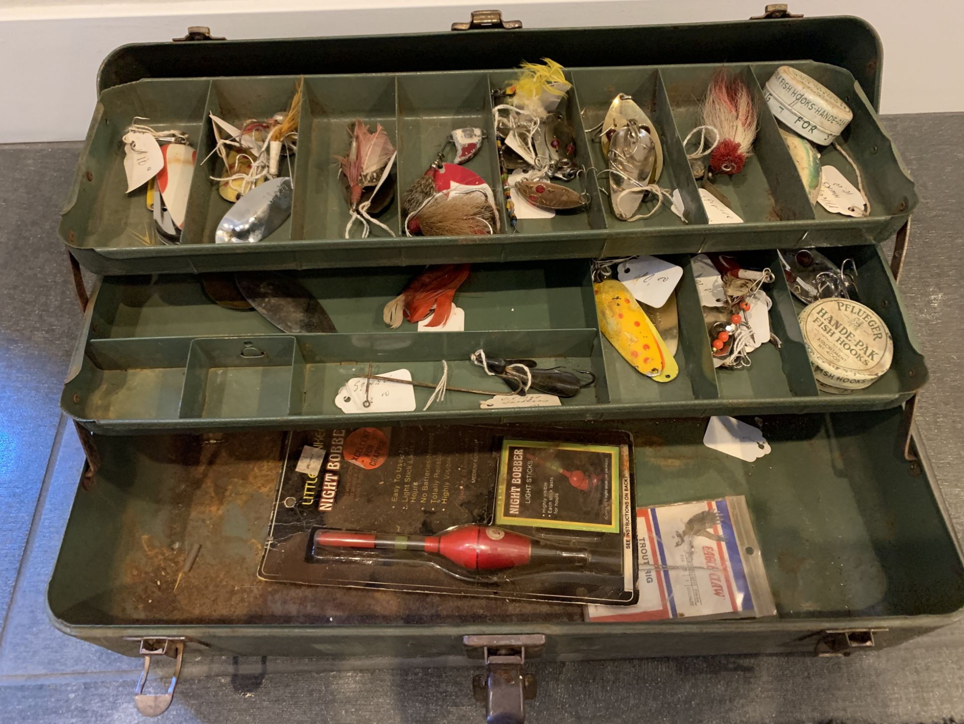 VINTAGE FISHERMAN'S TACKLE BOX WITH FISHING ITEMS INSIDE $350 VALUE LEATHER HANDLE ON CASE