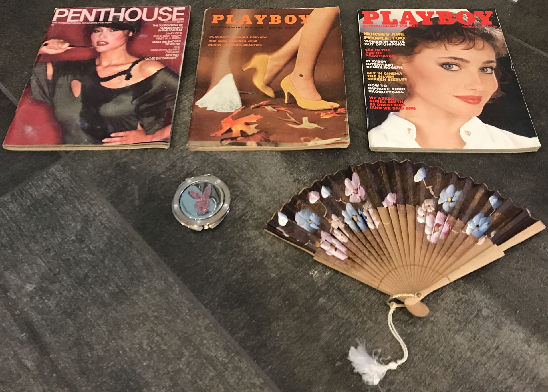 TWO VINTAGE PLAYBOY MAGAZINES A PENTHOUSE MAGAZINE. FOLD OUT FAN AND PLAYBOY MIRROR