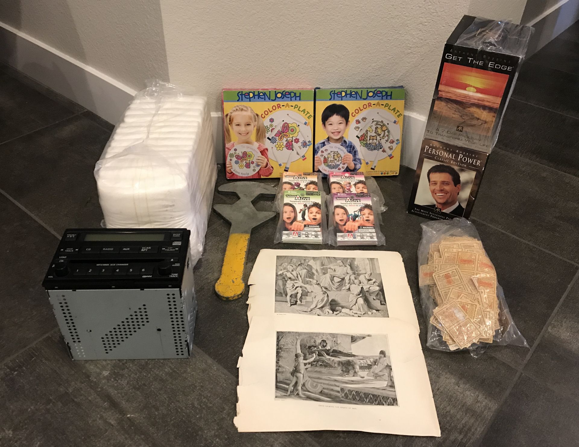 LOT OF ASSORTED RETAIL ITEMS. RADIO, ART PAGES, KIDS TATTOOS, PAINT A PLATE AND MORE