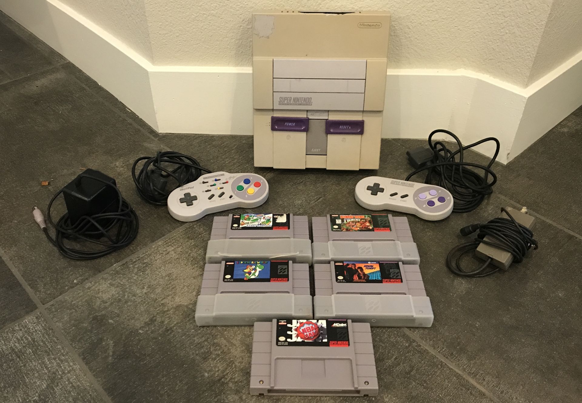 SUPER NINTENDO ENTERTAINMENT SYSTEM WITH TWO CONTROLLERS AND ADAPTERS, FIVE GAMES ALSO INCLUDED