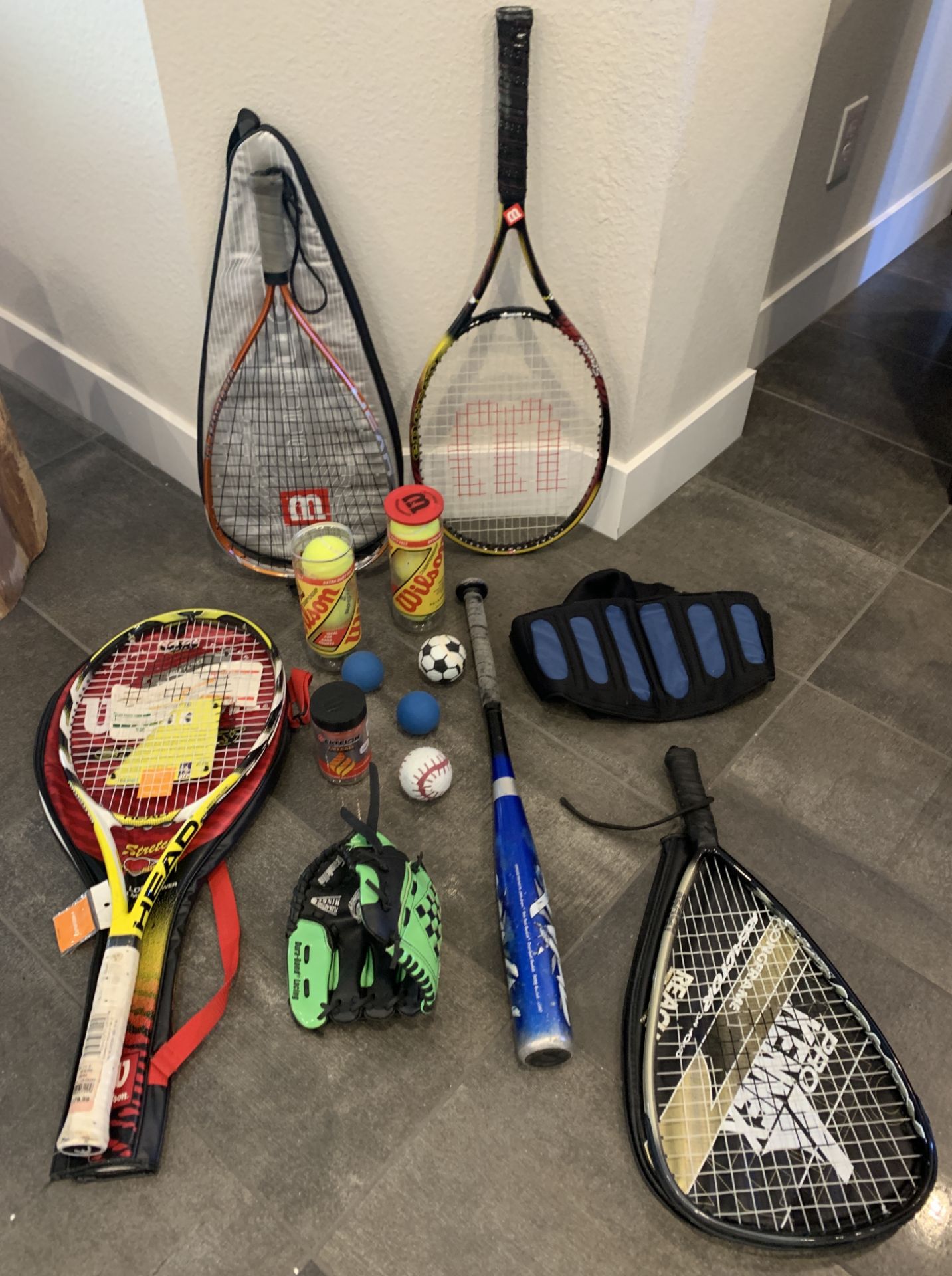 LOT OF TENNIS, SQUASH AND OTHER SPORTS ITEMS AND RACKETS , SOME NEW
