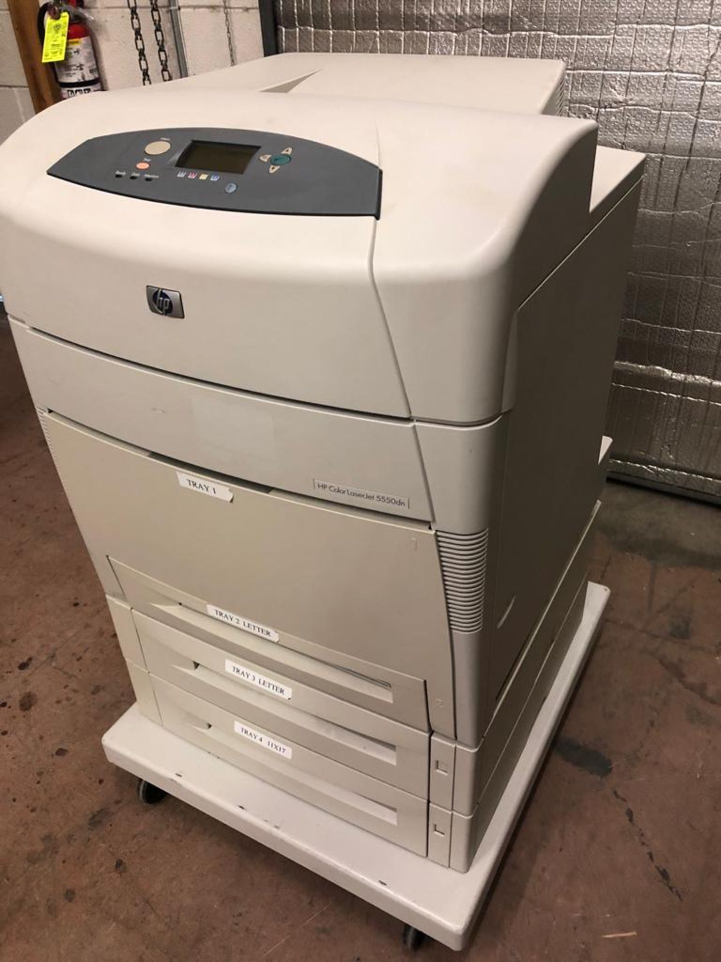 HP Color LaserJet 5550dn Printer on wheeled cart with extra trays