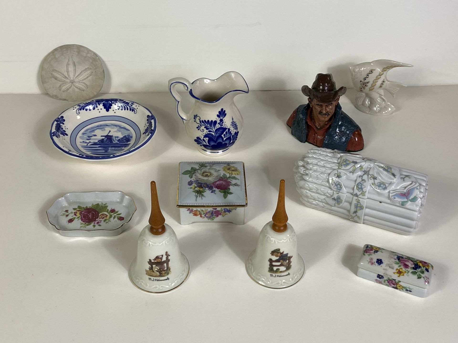 11 Porcelain Figures, 2 MJ Hummel Bells, Elizabeth Arden, Delta Blue, Sand Dollar, Etc