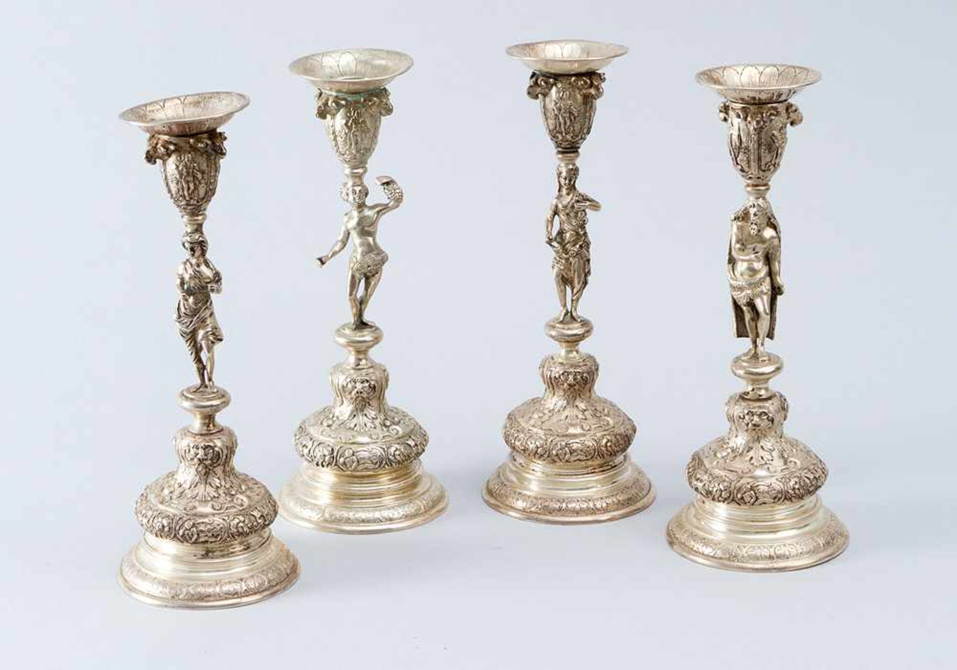 Set of four seasons silver candle sticks