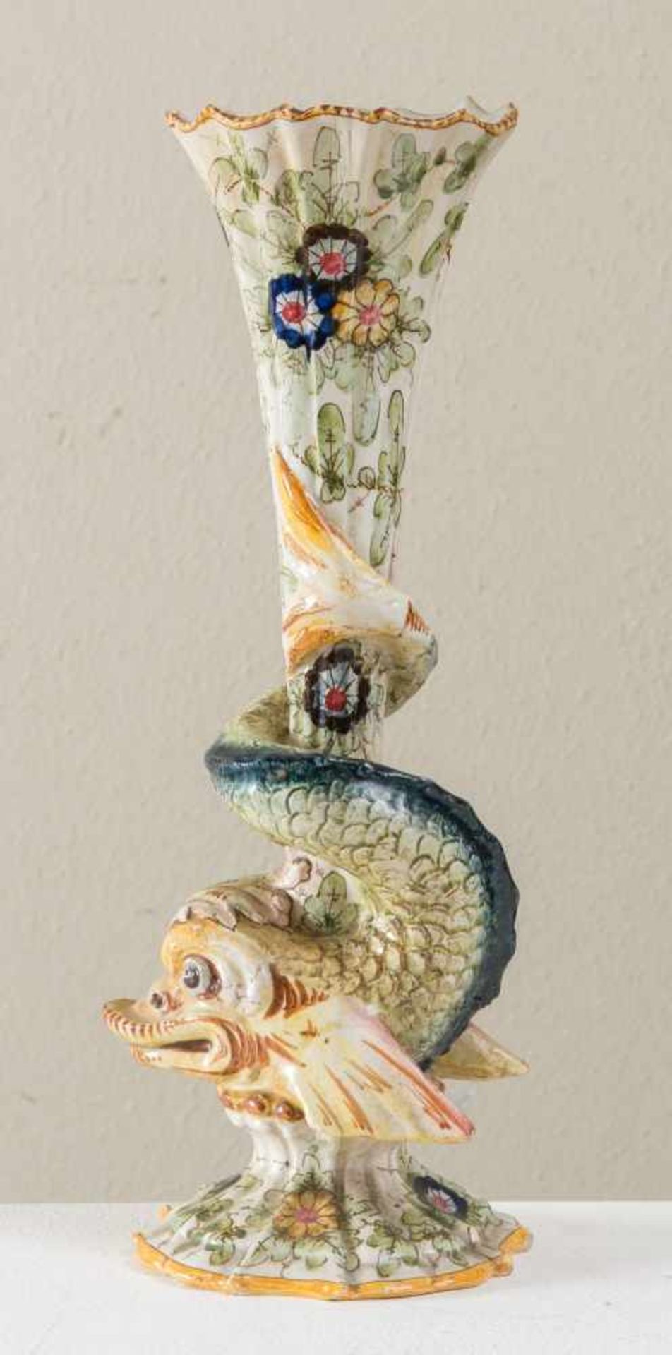 FRATELLI MINARDI (Faenza, inizio del XX secolo). Vaso in maiolica a foggia di tritone, sormontato da