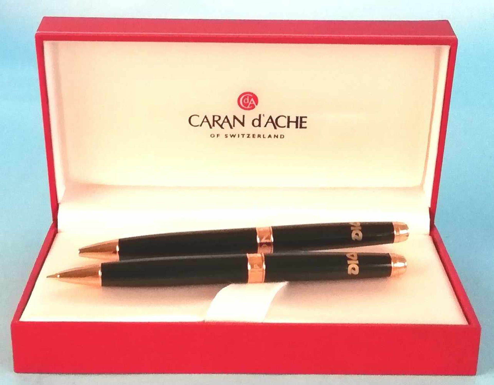 Caran d'Ache - 2 Kugelschreiber CARAN Gold double, schwarz, Firmenemblem, in Originaletui;