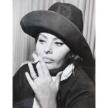 Sophia Lauren smoking in the New York airport lounge, waiting her flight to Madrid, ca. 1960