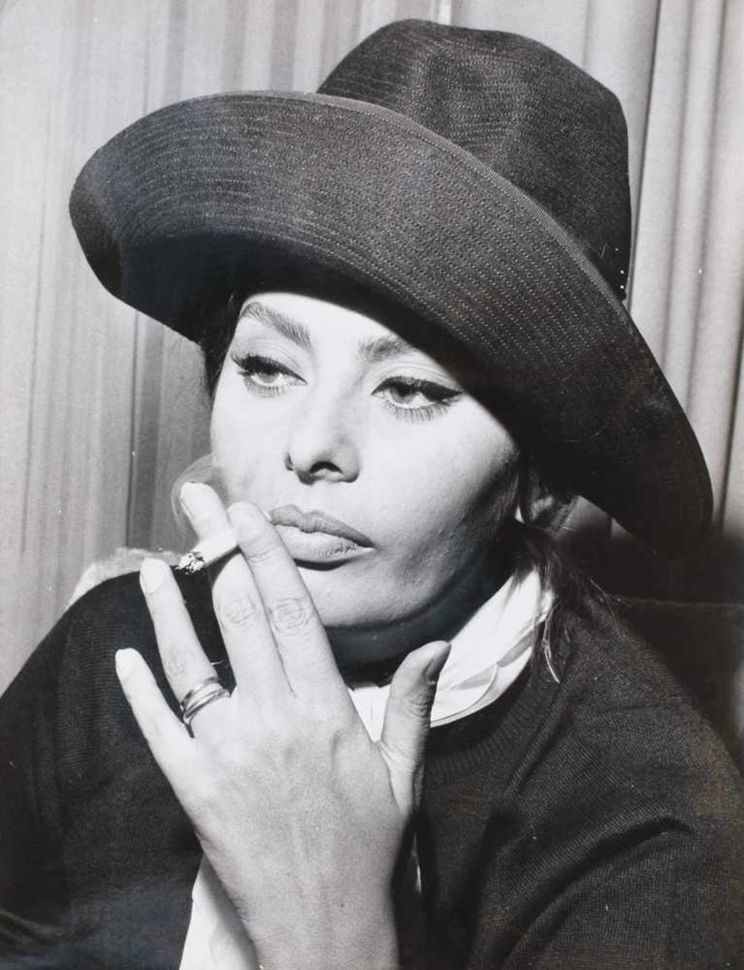 Sophia Lauren smoking in the New York airport lounge, waiting her flight to Madrid, ca. 1960