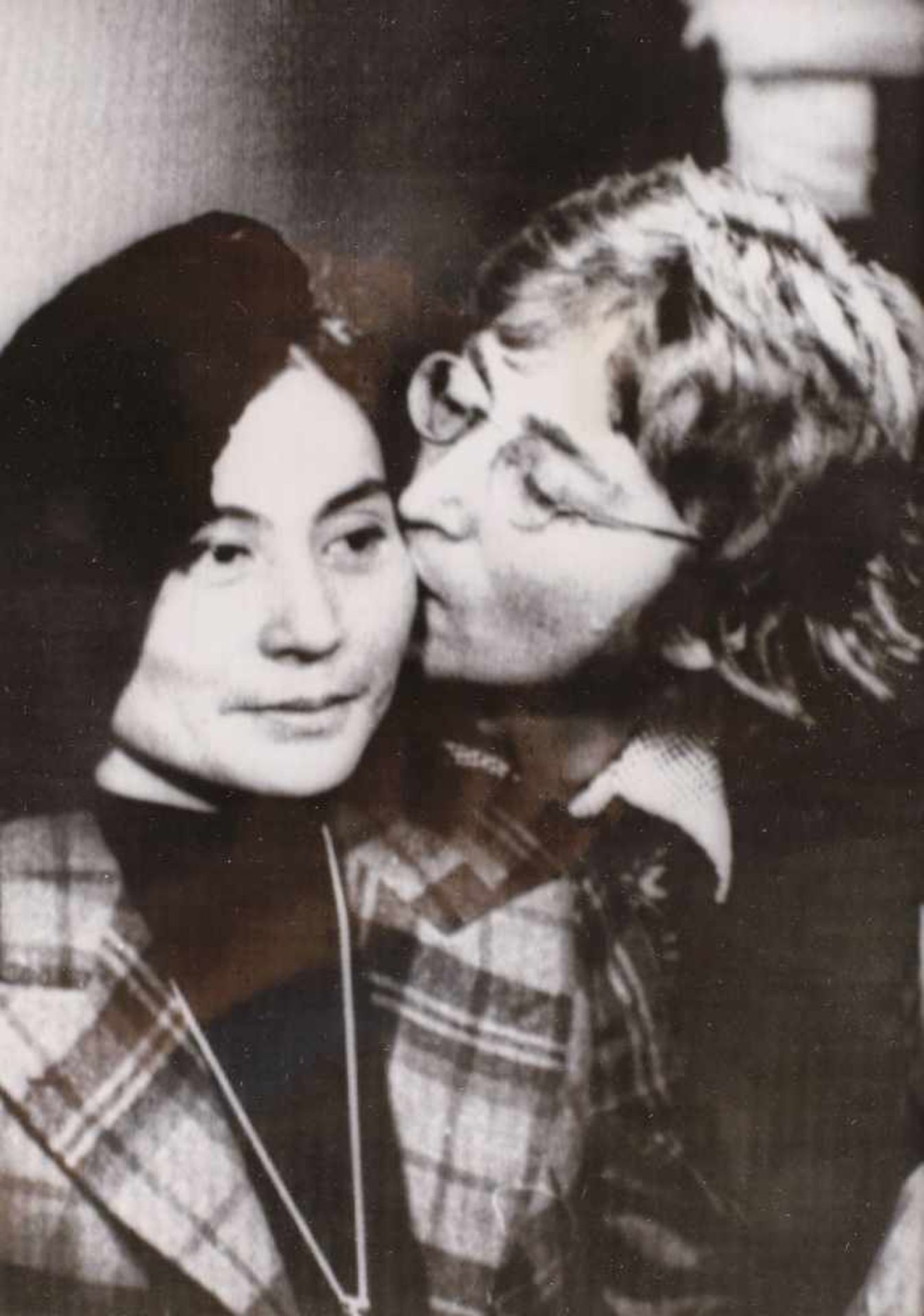 John Lennon and Yoko Ono in a moment of intimacy, press photograph, approx. 1970