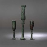 Three bronze candlesticks, possibly Luristan, Persia, the first part of the first millennium B.C.